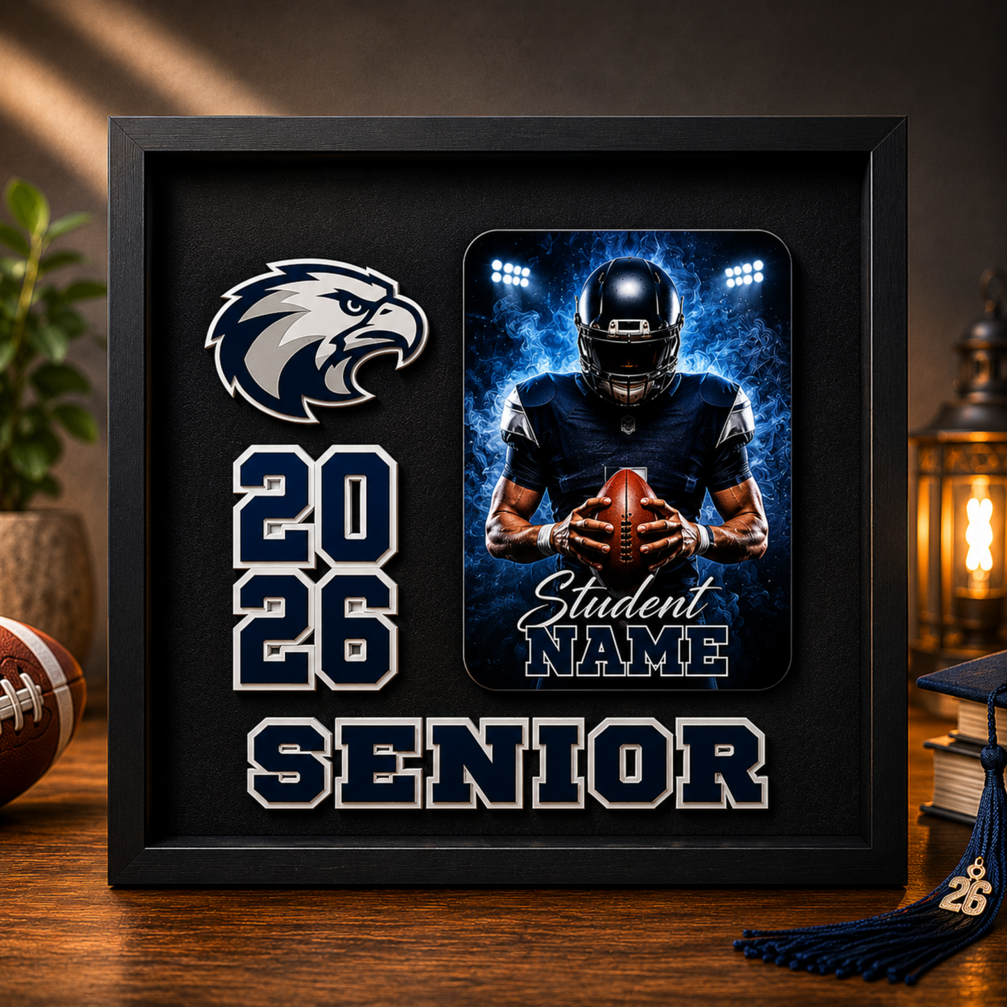 Framed sports-themed shadow box with football player and text on a wooden surface.