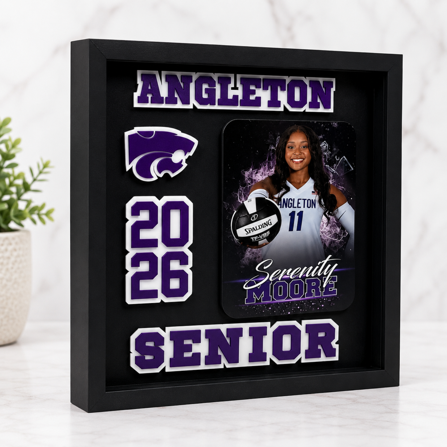 Shadow box with personalized sports-themed design featuring a photo of a player, numbers, and text.